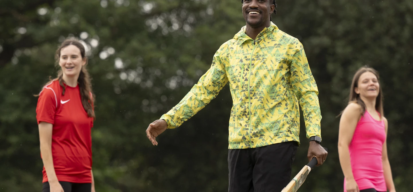 Group playing cricket at The Pitches at Greenwich Park