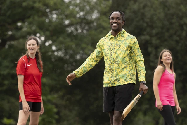 Group playing cricket at The Pitches at Greenwich Park