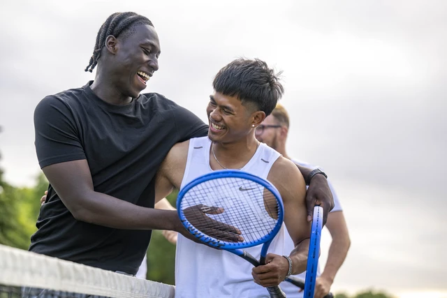 Group playing tennis at Hyde Park