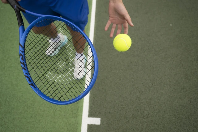 Tennis racquet and ball