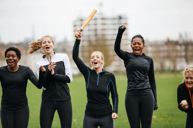 Women cheering rounders game